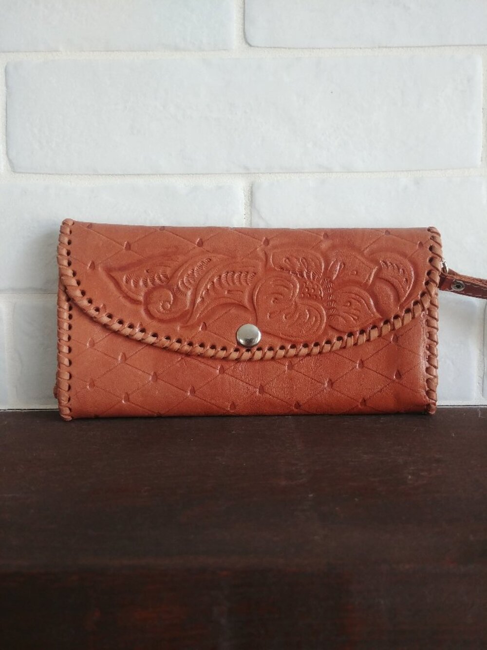 Embossed light brown leather wallet
